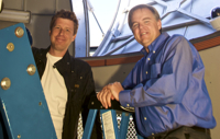 Andy Howell (left) and Lars Bildsten with LCOGT's prototype 1-meter telescope at headquarters in Goleta.