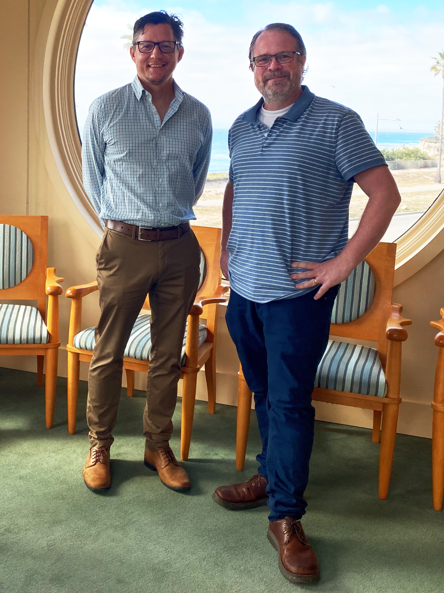 James Dent and Joel Walker standing together in the Tower Room at Kohn Hall